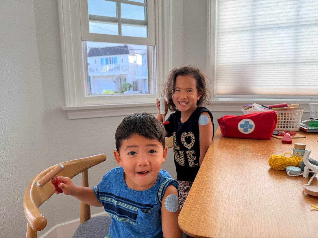 Two kids wearing the Thimble Prepare patch